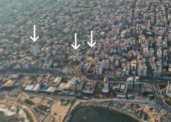 إنذار بإخلاء مبنى وقصف آخر